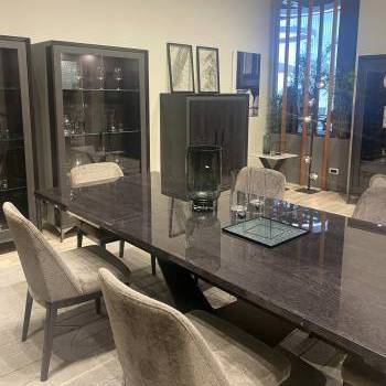 Table, chairs, and display cabinets by Camel Group