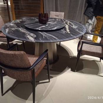 Round table and upholstered chairs by Malerba